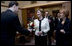 Mrs. Laura Bush accepts a bouquet of flowers as she arrives for tea Friday, April 4, 2008, with Mrs. Milka Mesic, right, spouse of Croatian President Stjepan Mesic, at the Office of the President in Zagreb.