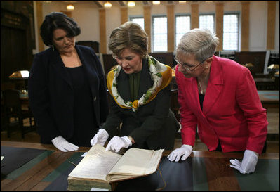 Mrs. Laura Bush is shown a rare book during her visit Saturday, April 5, 2008, to the Croatian State Archives in Zagreb.