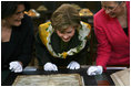 Mrs. Laura Bush is shown an ancient map during her visit Saturday, April 5, 2008, to the Croatian State Archives in Zagreb.