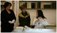 Mrs. Laura Bush visits with a preservation technician during her visit Saturday, April 5, 2008, to the Croatian State Archives in Zagreb.