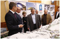 President George W. Bush and Mrs. Laura Bush are briefed by President-elect Dmitriy Medvedev, left, on the 2014 Winter Olympics in Sochi during their visit Saturday, April 5, 2008, to President Vladimir Putin's summer retreat in Sochi, Russia.