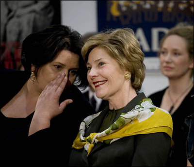 Mrs. Laura Bush watches the Lado National Fold Dance Ensemble performance, Saturday, April 5, 2008 in Zagreb, as an interpreter translates the performance lyrics for her.