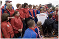 Mrs. Laura Bush holds a T-shirt presented to her Sunday, April 6, 2008, by members of the Russian Paralympic team at Central Sochi Stadium in Sochi, Russia.