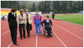 Mrs. Laura Bush walks on the track of Central Sochi Stadium Sunday, April 6, 2008, with Mr. Mikhail Terentyev, Secretary General of the Russian Paralympic Committee, Ms. Lisa Carty, spouse of the U.S. Ambassador to Russia William Burns, and Mrs. Irina Gromova, Coach of the Russian Paralympic team.