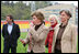 Mrs. Laura Bush blows a whistle to start the 100-meter wheelchair race Sunday, April 6, 2008, during her visit with the Russian Paralympic Team at Central Sochi Stadium in Sochi, Russia.