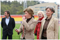 Mrs. Laura Bush blows a whistle to start the 100-meter wheelchair race Sunday, April 6, 2008, during her visit with the Russian Paralympic Team at Central Sochi Stadium in Sochi, Russia.