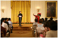 Mrs. Laura Bush welcomes Salma Kikwete, First Lady of Tanzania, during her remarks before a performance from Ford Theatre's new production, One Destiny, Monday, April 7, 2008, in the East Room of the White House.