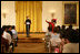 Mrs. Laura Bush welcomes Salma Kikwete, First Lady of Tanzania, during her remarks before a performance from Ford Theatre's new production, One Destiny, Monday, April 7, 2008, in the East Room of the White House.