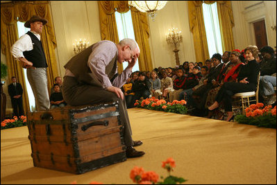 Mrs. Laura Bush and Salma Kikwete, First Lady of Tanzania, watch a performance from Ford's Theatre's new production, One Destiny, Monday, April 7, 2008, in the East Room of the White House.