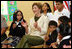 Mrs. Laura Bush applauds program speakers as she joins students from the Williams Preparatory School in Dallas, Thursday, April 10, 2008, during events at the First Bloom program to help encourage youth to get involved with conserving America's National Parks. Through the First Bloom program, the National Park Foundation and the National Park Services are joining with the Lady Bird Johnson Woldflower Center and community groups to connect young people to our national parks.