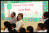 Mrs. Laura Bush sits before a banner welcoming her to the Williams Preparatory School in Dallas, Thursday, April 10, 2008, where she participated in the First Bloom program activities to help encourage youth to get involved with conserving America's National Parks. The First Bloom program is being introduced in five cities across the nation to give children a sense of pride in our natural resources and to be good stewarts of America's diverse environment.