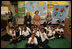 Mrs. Laura Bush, her daughter Jenna Bush, left, and U.S. Education Secretary Margaret Spellings pose for a photo with the first grade students of teacher Laura Gilbertson, right, Monday, April 14, 2008, at the Martin Luther King Elementary School in Washington, D.C., to mark the tenth anniversary of Teach for America Week.