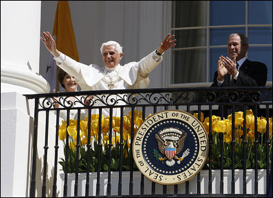 President George W. Bush and Laura Bush applaud as Pope Benedict XVI acknowledges being sung happy birthday by the thousands of guests Wednesday, April 16, 2008, at his welcoming ceremony on the South Lawn of the White House.