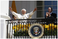 President George W. Bush and Laura Bush applaud as Pope Benedict XVI acknowledges being sung happy birthday by the thousands of guests Wednesday, April 16, 2008, at his welcoming ceremony on the South Lawn of the White House.