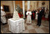 President George W. Bush and Mrs. Laura Bush lead the celebration of the 81st birthday of Pope Benedict XVI as he's presented a cake by White House Pastry Chef Bill Yosses Wednesday, April 16, 2008, at the White House.