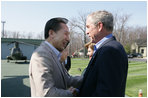 President George W. Bush and Laura Bush welcome South Korean President Lee Myung-bak and his wife, Kim Yoon-ok, Friday, April 18, 2008, to the Presidential retreat at Camp David, Md.