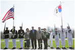 President George W. Bush and Laura Bush pose with South Korean President Lee Myung-bak and his wife, Kim Yoon-ok, for a photo Friday, April 18, 2008, on their arrival to the Presidential retreat at Camp David, Md.