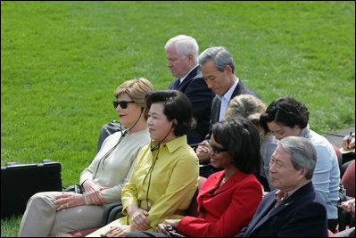 Mrs. Laura Bush joined by Mrs. Kim Yoon-ok, wife of the South Korean President Lee Myung-bak, U.S. Secretary of State Condoleezza Rice, and U.S. Defense Secretary Robert Gates listen during a joint press availability with President George W. Bush and South Korean President Lee Myung-bak Saturday, April 19, 2008, at the Presidential retreat at Camp David, Md.