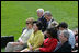 Mrs. Laura Bush joined by Mrs. Kim Yoon-ok, wife of the South Korean President Lee Myung-bak, U.S. Secretary of State Condoleezza Rice, and U.S. Defense Secretary Robert Gates listen during a joint press availability with President George W. Bush and South Korean President Lee Myung-bak Saturday, April 19, 2008, at the Presidential retreat at Camp David, Md.