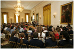 Mrs. Laura Bush and daughter, Jenna Bush, read a book to children of White House staff at Bring Your Child to Work Day Thursday, April 24, 2008, in the East Room of the White House.