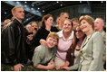 Mrs. Laura Bush joins members of the audience for photos Monday, Aug. 4, 2008, after remarks by President George W. Bush at Eielson Air Force Base, Alaska.