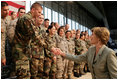 Mrs. Laura Bush shakes hands with military personnel Monday, Aug. 4, 2008, following remarks by President George W. Bush during their stop at Eielson Air Force Base, Alaska.