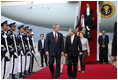 President George W. Bush and Mrs. Laura Bush are welcomed on their arrival Tuesday, Aug. 5, 2008 to Seoul Airbase, outside Seoul, South Korea, by Korean Minister of Foreign Affairs and Trade Yu Myung-hwan.