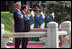 President George W. Bush and President Myung-bak Lee of the Republic of Korea, pause for their respective national anthems Wednesday, Aug. 6, 2008, during arrival ceremonies for President Bush and Mrs. Laura Bush in Seoul.