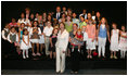 President George W. Bush, top center, and Mrs. Laura Bush stop to pose with a group of elementary school children at the Blue House in Seoul on August 6, 2008.