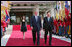 President George W. Bush walks with President Lee Myung-bak of the Republic of Korea, along with Mrs. Laura Bush and Barbara Bush, as they arrive at the Blue House, the presidential residence, Wednesday, Aug. 6, 2008, in Seoul.