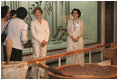 Mrs. Laura Bush tours the National Folk Museum of Korea in Seoul during her August 6, 2008 visit to Korea. The tour is led by Ms Yi, Ki Won, right, Deputy Director of Cultural Exchange and Education at the museum.