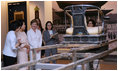 Mrs. Laura Bush gets a tour of the National Folk Museum of Korea in Seoul. Next to her in the light rose suit is Mrs. Kim Yoon-ok, wife of the President of the Republic of Korea.