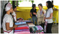 Mrs. Laura Bush and daughter Ms. Barbara Bush look over the weaving done by refugee women at the Mae La Refugee Camp at Mae Sot, Thailand, on Aug. 7, 2008. This traditional Karen craft helps the refugees make money and can be bought via the Internet through consortiums that work with the women in the camp which houses at least 39,000 Burmese.