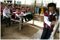 Mrs. Laura Bush sits in on a grammar class during her visit on Aug. 7, 2008 to the Mae La Refugee Camp at Mae Sot, Thailand. The camp, the largest of nine in Thailand, houses at least 39,000 Burmese refugees, many of whom home to resettle in the United States if conditions do not permit them to return to their home country.