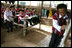 Mrs. Laura Bush sits in on a grammar class during her visit on Aug. 7, 2008 to the Mae La Refugee Camp at Mae Sot, Thailand. The camp, the largest of nine in Thailand, houses at least 39,000 Burmese refugees, many of whom home to resettle in the United States if conditions do not permit them to return to their home country.