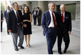 President George W. Bush is greeted by U.S. Ambassador Sandy Randt upon his arrival Friday, Aug. 8, 2008, at the U.S. Embassy in Beijing. With them are former President George H.W. Bush and Ms. Barbara Bush.