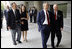 President George W. Bush is greeted by U.S. Ambassador Sandy Randt upon his arrival Friday, Aug. 8, 2008, at the U.S. Embassy in Beijing. With them are former President George H.W. Bush and Ms. Barbara Bush.