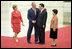 President George W. Bush and Mrs. Laura Bush are greeted by Chinese President Hu Jintao and Madam Liu Yongqing at the Great Hall of the People in Beijing Friday, Aug. 8, 2008, for the social lunch in honor of the 2008 Summer Olympic Games.