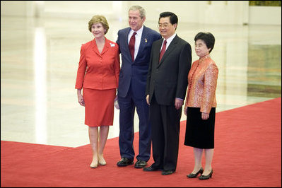 President George W. Bush and Mrs. Laura Bush participate in a photo opportunity with President Hu Jintao of the People's Republic of China and Madam Liu Yongqing at the social luncheon in honor of the 2008 Summer Olympic Games in Beijing. The luncheon was held at the Great Hall of the People.