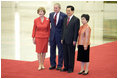 President George W. Bush and Mrs. Laura Bush participate in a photo opportunity with President Hu Jintao of the People's Republic of China and Madam Liu Yongqing at the social luncheon in honor of the 2008 Summer Olympic Games in Beijing. The luncheon was held at the Great Hall of the People.