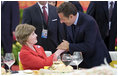 Mrs. Laura Bush is greeted by France President Nicolas Sarkozy during a social luncheon Friday, Aug. 8, 2008, at the Great Hall of the People in Beijing in honor of the 2008 Summer Olympic Games.