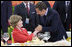 Mrs. Laura Bush is greeted by France President Nicolas Sarkozy during a social luncheon Friday, Aug. 8, 2008, at the Great Hall of the People in Beijing in honor of the 2008 Summer Olympic Games.