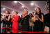 Mrs. Laura Bush stands with Mrs. Sarah Randt, spouse of U.S. Ambassador to China Sandy Randt, left, Mrs. Anne Johnson, Director of Art in Embassies Program, and Ms. Barbara Bush during applause for President George W. Bush Friday, Aug. 8, 2008, at the dedication ceremony for the U.S. Embassy in Beijing.