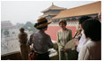 Mrs. Laura Bush listens as Mrs. Sarah Randt, spouse of the U.S. Ambassador to the People's Republic of China, leads a tour of the Forbidden City Friday, Aug. 9, 2008, in Beijing.