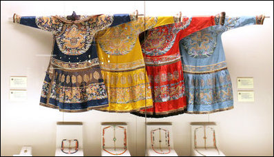 A display of three dresses and some jewelry is seen at the Exhibition of Imperial Garments and Jewelry viewed by Mrs. Laura Bush during her tour Saturday, Aug. 9, 2008, of the Forbidden City in Beijing.