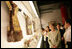 Mrs. Laura Bush closely examines a display at the Exhibition of Imperial Garments and Jewelry Saturday, Aug. 9, 2008, during her tour of the Forbidden City in Beijing.