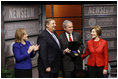 President George W. Bush, joined by Mrs. Laura Bush, is presented with the International Medal of PEACE by Pastor Rick Warren and his wife, Kay Warren, left, Monday, Dec. 1, 2008, following their partipation at the Saddleback Civil Forum on Global Health in Washington, D.C.