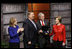 President George W. Bush, joined by Mrs. Laura Bush, is presented with the International Medal of PEACE by Pastor Rick Warren and his wife, Kay Warren, left, Monday, Dec. 1, 2008, following their partipation at the Saddleback Civil Forum on Global Health in Washington, D.C.