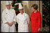 Mrs. Laura Bush is joined by White House Executive Chef Cris Comerford, and Bill Yosses, White House Pastry Chef, during the 2008 White House Holiday Press Preview Wednesday, Dec. 3., 2008, in the East Room. Said Mrs. Bush, "This is a special holiday for us... our final in the White House. Thank you to the American people for their friendship, prayers, and support. The President and I wish you and your families a very happy holiday."