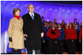 President George W. Bush and Mrs. Laura Bush join the Enterprise High School Encores from Enterprise, Ala., on stage at the Ellipse Thursday, Dec. 4, 2008, during the Pageant of Peace festivities at the lighting of the National Christmas Tree in Washington, D.C.